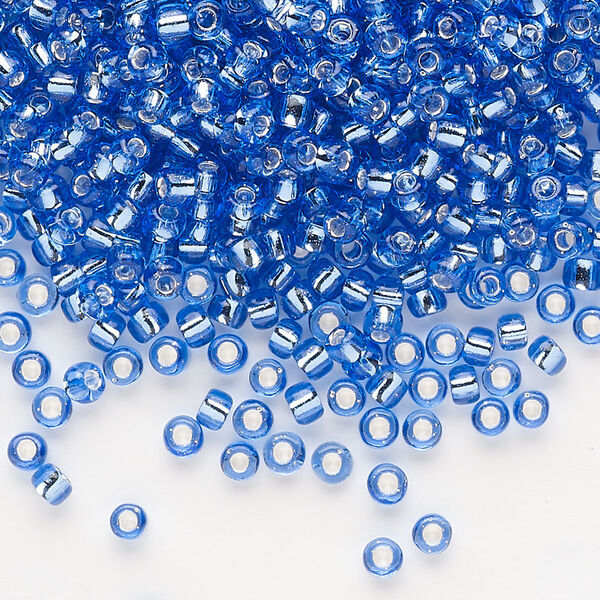 Seed bead, Dyna-Mites™, glass, silver-lined translucent blue, #8 round. Sold per 1/2 kilogram pkg. image number 0