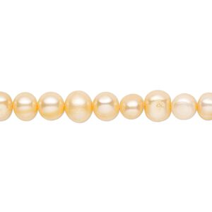 Pearl, cultured freshwater (dyed), peach, 5-6mm semi-round with 0.4-0.6mm hole, D grade, Mohs hardness 2-1/2 to 4. Sold per 14-inch strand.