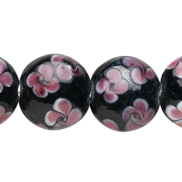 Bead, glass, opaque black and pink, 19x10mm puffed flat round with flowers design. Sold per 15-1/2" to 16" strand. image number 0