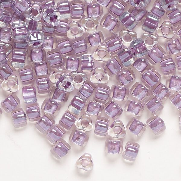 Seed bead, Miyuki, glass, transparent clear color-lined lavender, (TR1114), #5 triangle. Sold per 250-gram pkg. image number 0