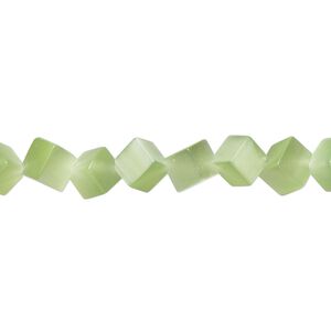 Bead, cat's eye glass (fiber optic glass), light green, 8mm diagonally drilled cube. Sold per 15-inch strand.