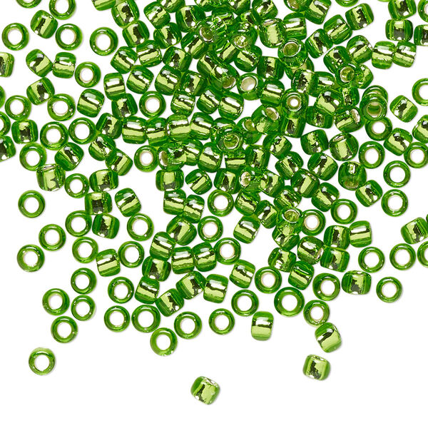 Seed bead, TOHO BEADS®, glass, pkg/7.5g, #8 round, transparent silver-lined peridot (TR-08-27). image number 0