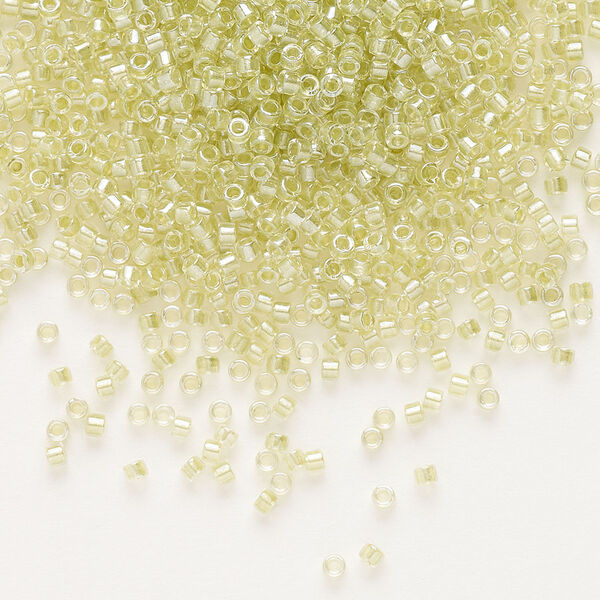 Seed bead, Delica®, glass, pkg/7.5g, #11 round, translucent peridot green-lined luster crystal clear (DB-0903). image number 0