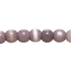 Bead, cat's eye glass (fiber optic glass), light purple, 7-9mm irregular round. Sold per 14-inch strand, approximately 50 beads.