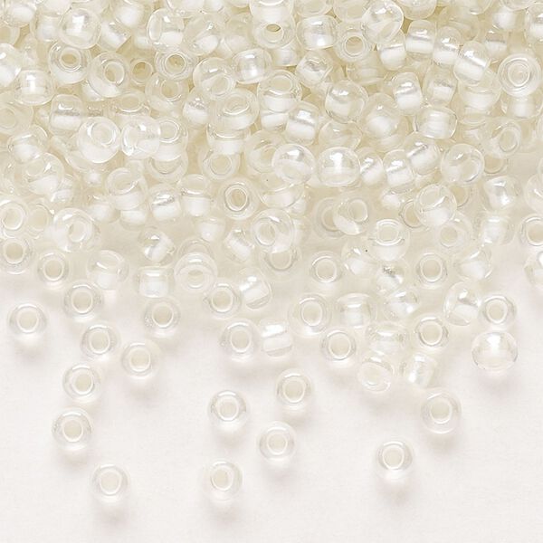 Seed bead, Preciosa Ornela Czech glass, pkg/50g, #8 rocaille, translucent color-lined luster pastel ivory, (382PI). image number 0