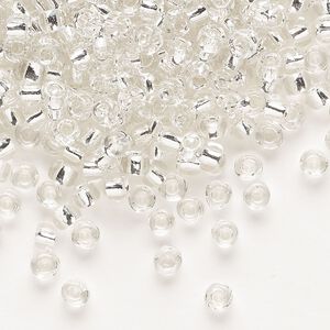 Seed bead, Dyna-Mites™, glass, transparent silver-lined clear, #6 round. Sold per 1/2 kilogram pkg.