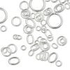 Jump ring mix, sterling silver, 3-10mm round with 1.4-7.6mm inside diameter and 4x3mm-7x5mm oval with 2.5x1.5mm-5x3.3mm inside diameter, 20-26 gauge. Sold per 5-gram pkg, approximately 75-85 jump rings. image number 0