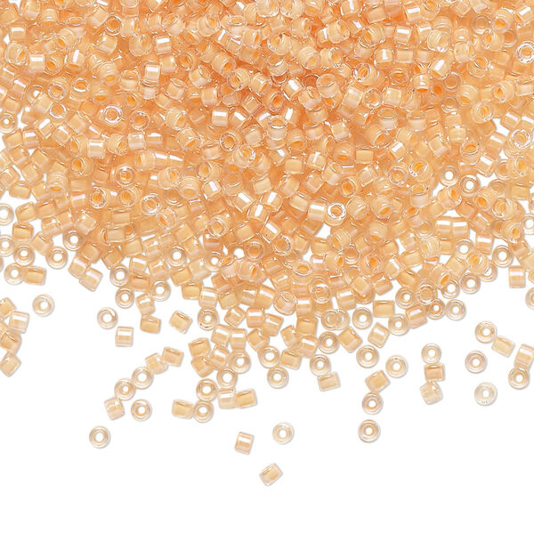 Seed bead, Delica®, glass, pkg/50g, #11 round, translucent light peach-lined luster crystal clear (DB-0067). image number 0