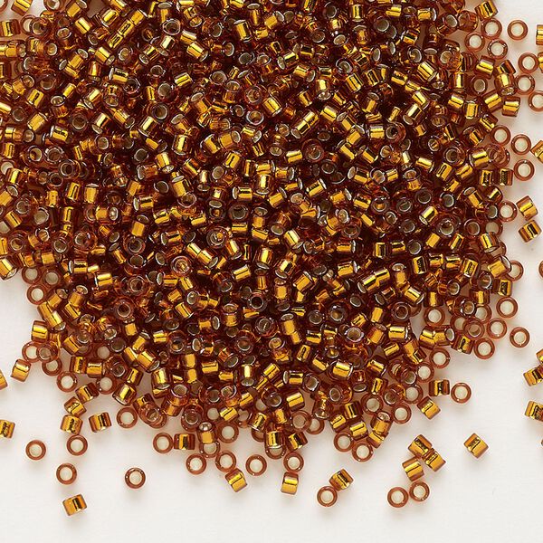 Seed bead, Delica®, glass, pkg/7.5g, #11 round, transparent silver-lined dark topaz (DB-0144). image number 0