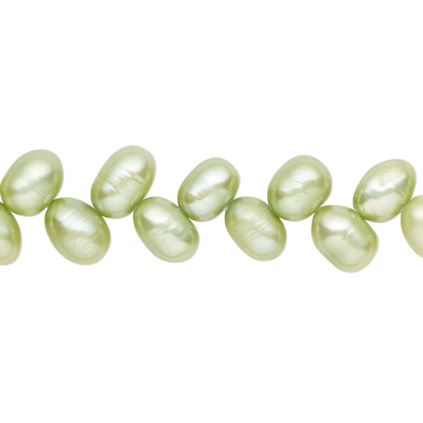 Pearl, cultured freshwater (dyed), lime green, 7x5mm-8x6mm herringbone-drilled rice with 0.4-0.6mm hole, C- grade, Mohs hardness 2-1/2 to 4. Sold per 14-inch strand. image number 0