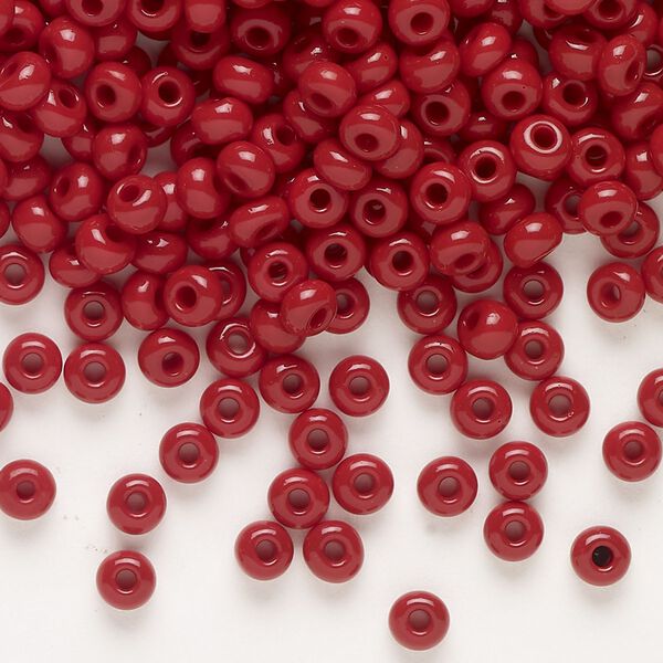 Seed bead, Preciosa Ornela, glass, opaque red coral, #6 rocaille. Sold per 500-gram pkg. image number 0