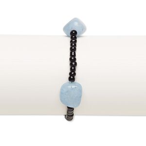Bracelet, stretch, quartz (dyed) and glass, black and blue, 3x2mm-5x4mm rondelle and small to medium tumbled nugget, 7 inches. Sold individually.