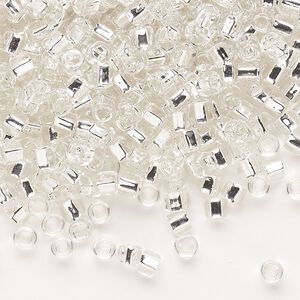 Seed bead, Dyna-Mites™, glass, silver-lined translucent clear, #6 round with square hole. Sold per 1/2 kilogram pkg.