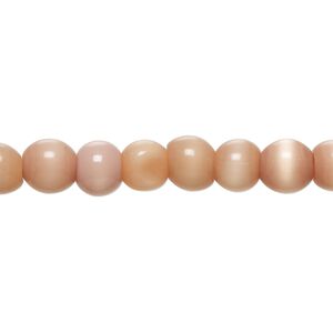 Bead, cat's eye glass (fiber optic glass), dark peach, 6-8mm irregular round. Sold per 14-inch strand, approximately 60 beads.