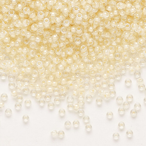 Seed bead, Miyuki, glass, pkg/25g, #11 rocaille, translucent ivory-lined luster crystal clear (RR-2215). image number 0
