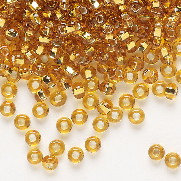 Seed bead, Preciosa Ornela Czech glass, pkg/500g, #6 rocaille, transparent silver-lined topaz, (17050). image number 0
