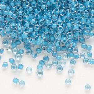 Seed bead, Dyna-Mites™, glass, translucent inside color turquoise blue, #8 round. Sold per 1/2 kilogram pkg.