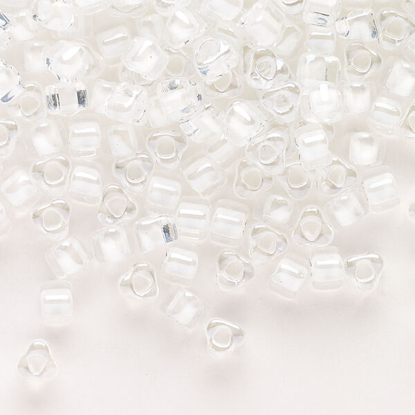 Seed bead, Miyuki, glass, transparent clear color-lined white, (TR1104), #5 triangle. Sold per 250-gram pkg. image number 0