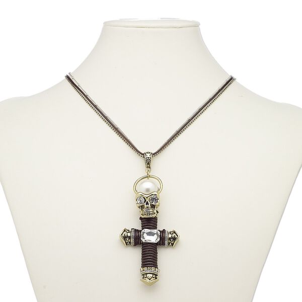 Necklace, acrylic pearl / glass / glass rhinestone / cotton cord / gold-finished brass / steel / "pewter" (zinc-based alloy), brown / clear / white, 3-1/2 x 1-3/4 inch cross with skull, 36 inches with 2-inch extender chain and lobster claw clasp. Sold individually. image number 0