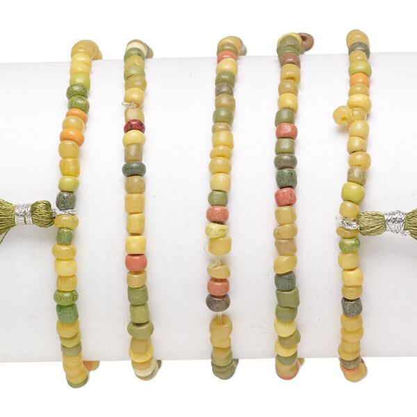 Bracelet mix, stretch, glass, olive green / orange / yellow, #6 round with 45mm tassel, 7-1/2 inches. Sold per pkg of 5. image number 0