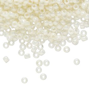Seed bead, TOHO BEADS®, glass, pkg/50g, #8 round, opaque luster Navajo white (TR-08-122).