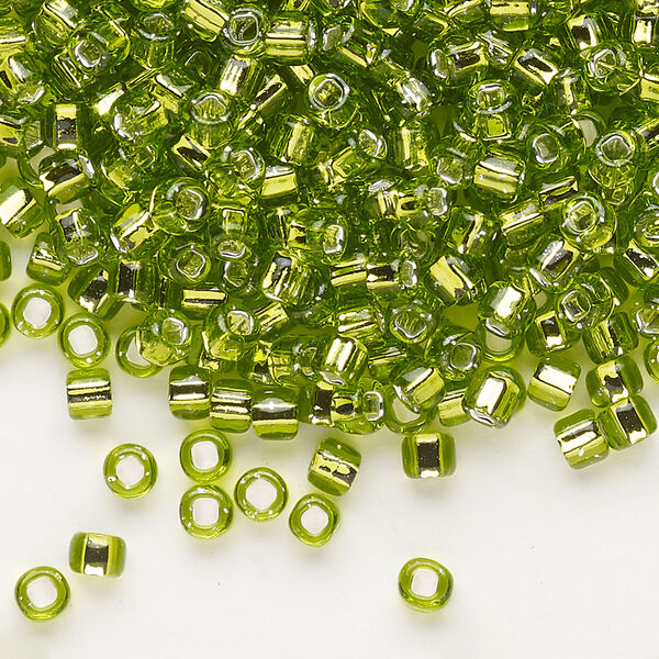 Seed bead, Dyna-Mites™, glass, silver-lined translucent light green, #6 round with square hole. Sold per 40-gram pkg. image number 0