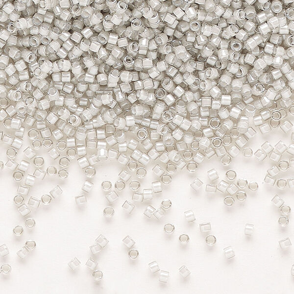 Seed bead, Delica®, glass, pkg/7.5g, #11 round, translucent moonstone-lined luster crystal clear (DB-2391). image number 0