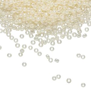 Seed bead, TOHO BEADS®, glass, pkg/7.5g, #11 round, translucent ceylon light ivory (TR-11-147).