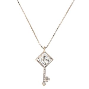 Necklace, Czech glass / Czech glass rhinestone / gold-finished steel / brass / "pewter" (zinc-based alloy), clear, 32x17mm key, 17 inches with 2-inch extender chain and lobster claw clasp. Sold individually.