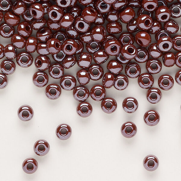 Seed bead, glass, pkg/50g, #6 rocaille, opaque luster purple. image number 0