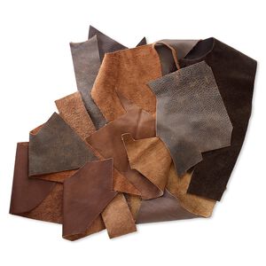 Leather scrap mix (natural / dyed), brown tones, mixed shape. Sold per 1/2 pound pkg.