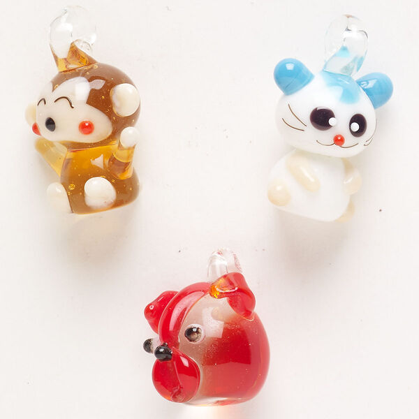 Random focal mix, lampworked glass, pkg/3, opaque and translucent mixed colors with silver-colored foil and copper-colored glitter, 18x16mm-24x21mm mixed animal shapes. image number 0