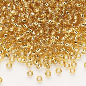 Seed bead, Dyna-Mites™, glass, silver-lined translucent medium gold, #8 round. Sold per 40-gram pkg.