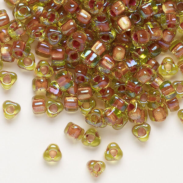 Seed bead, Miyuki, glass, transparent lime color-lined copper, (TR1818), #5 triangle. Sold per 25-gram pkg. image number 0