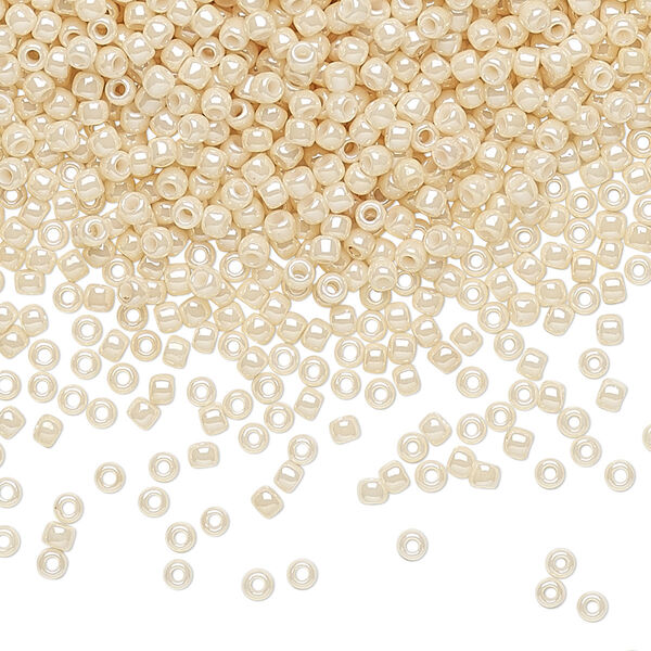 Seed bead, TOHO BEADS®, glass, pkg/7.5g, #11 round, opaque luster light beige (TR-11-123). image number 0