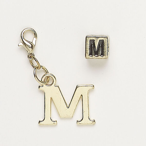 Bead and charm 1pkg2, antique gold-finished "pewter" (zinc alloy) / steel / enamel, black, 7mm cube with alphabet letter "M" and 17x12mm alphabet letter "M" with lobster claw clasp. image number 0