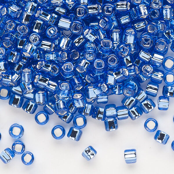 Seed bead, Dyna-Mites™, glass, silver-lined translucent blue, #6 round with square hole. Sold per 40-gram pkg. image number 0
