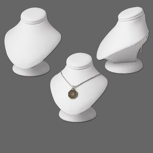 Leatherette mini-pedestal display, white. 3-1/2in wide x 3-1/4in deep x 3-3/4in high. Sold individually.