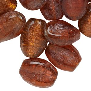 Bead, lampworked glass, translucent red-orange, 18x13mm-19x15mm twisted flat oval with copper-colored glitter. Sold per pkg of 25.