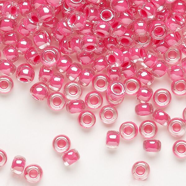 Seed bead, Miyuki, glass, pkg/250g, #6 rocaille, translucent carnation pink-lined luster crystal clear (RR-208). image number 0