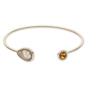 Bracelet, cuff, glass / resin / gold-finished steel, gold / brown / amber brown, 2mm wide with 10mm round and 16x12mm teardrop, adjustable from 7-1/2 to 8 inches. Sold individually.