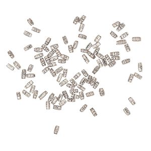 Bead, antiqued fine silver, 2x1mm textured oval. Sold per 1-gram pkg, approximately 95 beads.