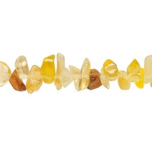 Bead, glass, translucent light golden brown, small to extra-large chip. Sold per 30-inch strand.