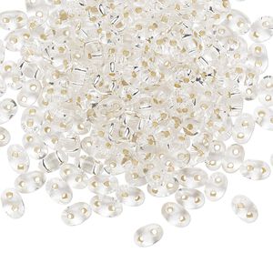 Seed bead, Preciosa Twin™ Czech glass, pkg/250g, 5x2.5mm oval, transparent silver-lined clear, (78102).