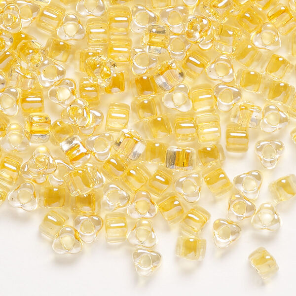 Seed bead, Miyuki, glass, transparent clear color-lined light gold, (TR1107), #5 triangle. Sold per 25-gram pkg. image number 0