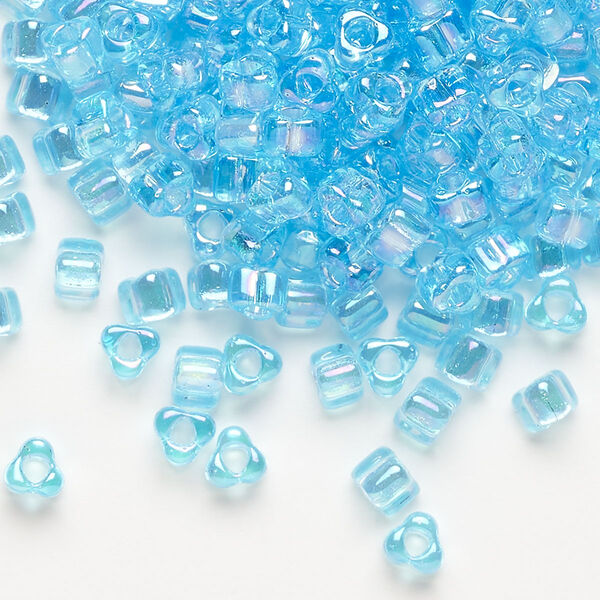 Seed bead, Miyuki, glass, transparent iris light blue, (TR1155), #5 triangle. Sold per 25-gram pkg. image number 0