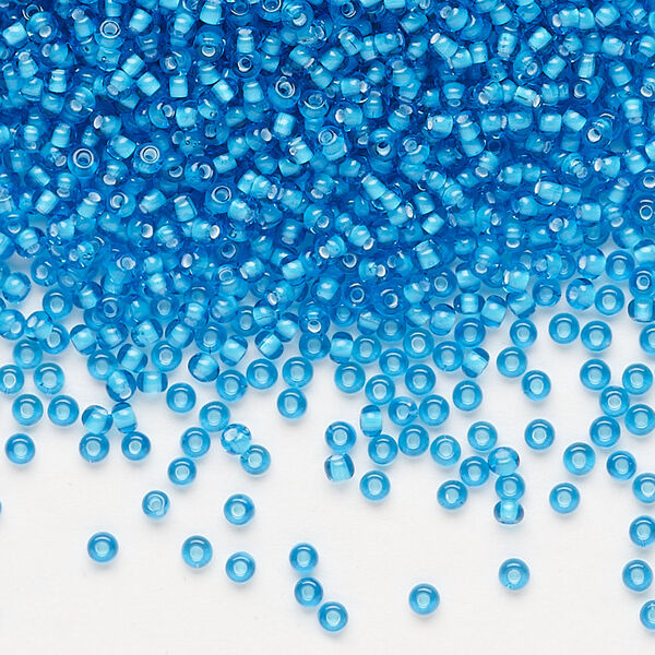 Seed bead, Preciosa Ornela, glass, transparent chalkwhite-lined aquamarine, #11 rocaille. Sold per 50-gram pkg. image number 0