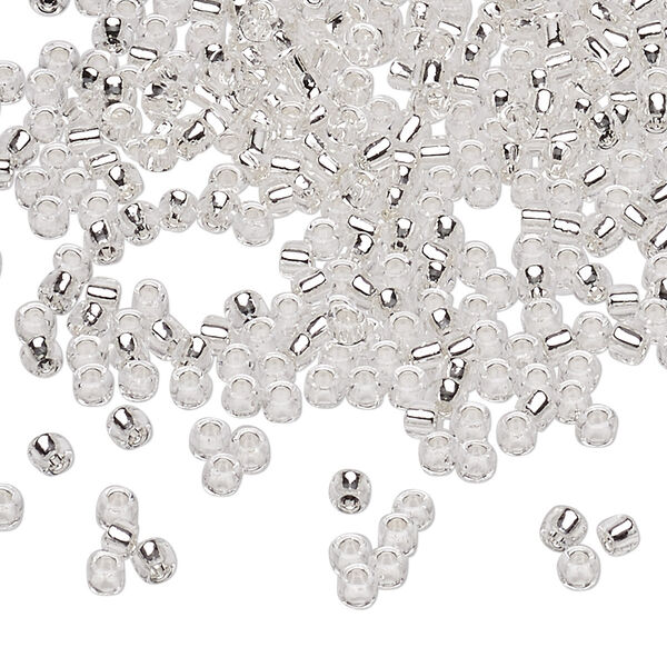 Seed bead, Dyna-Mites™, glass, silver-lined translucent clear, #8 round. Sold per 40-gram pkg. image number 0