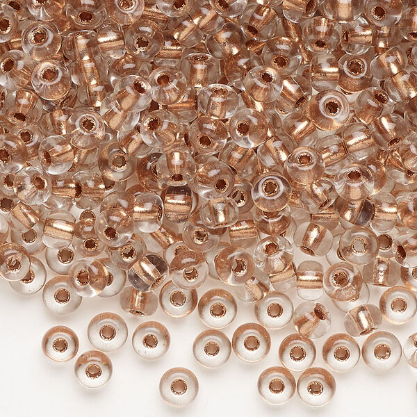 Seed bead, glass, pkg/100g, #6 round, translucent light copper-lined crystal clear. image number 0