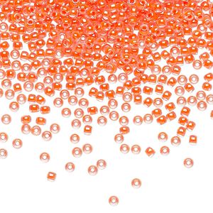Seed bead, TOHO BEADS®, glass, pkg/7.5g, #11 round, translucent luminous inside color neon salmon (TR-11-803).